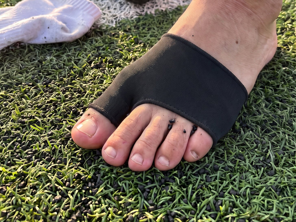 The Olyra Blister Sleeve on a bare foot, seen from above