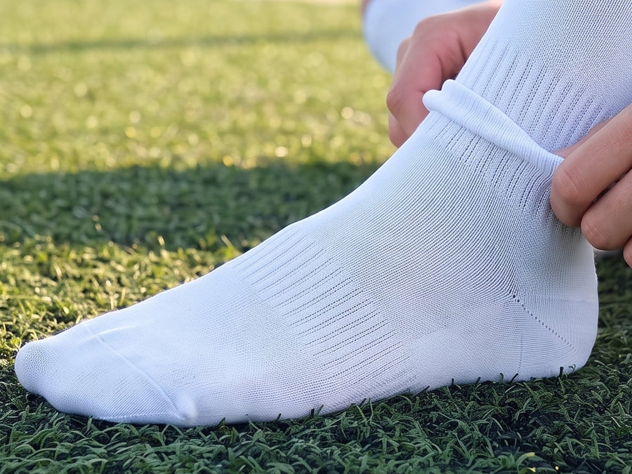 Step 2: pulling a soccer sock over the sleeve